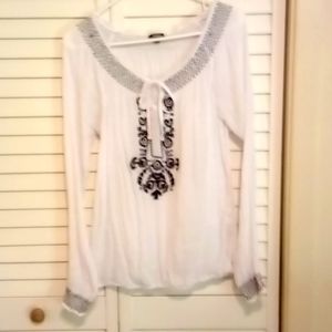 Woman's XOXO embroidered blouse.